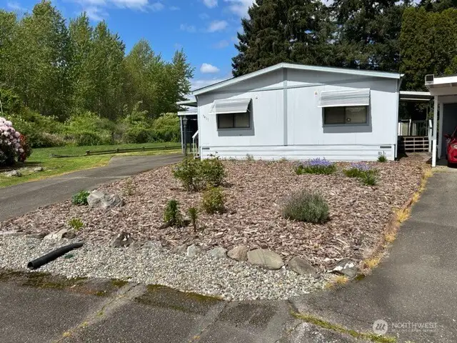 Beautiful landscape with Open space to the left of the home.