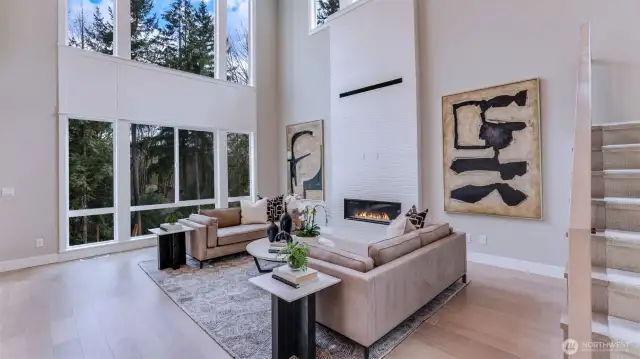 All photos seen for Lot #4 are of the Model Home (Lot #3). Awe-inspiring Great Room with its mesmerizing 20' ceiling, sleek modern fireplace framed by breathtaking floor-to-ceiling custom tile work!