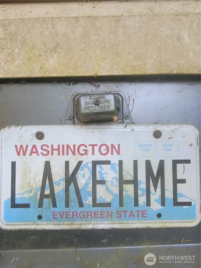 License plate to RV parked up by lakefront!