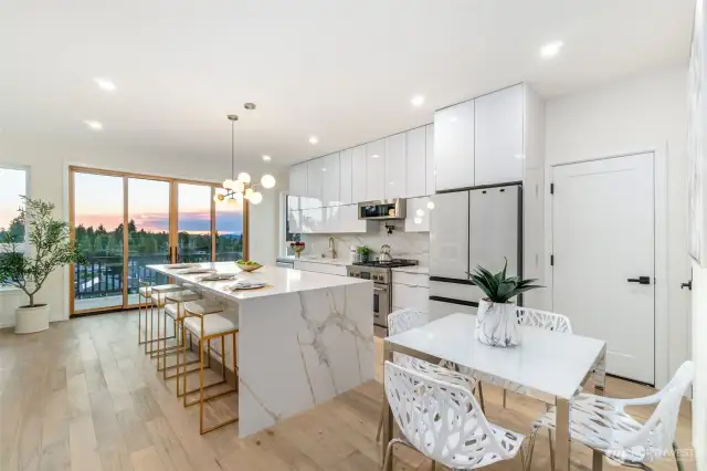 Chef's kitchen with gas range, pantry, and ample storage