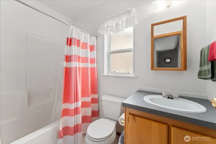 Common full bath serving bedrooms 2 & 3
