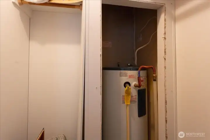 Hot water tank located in second bedroom closet