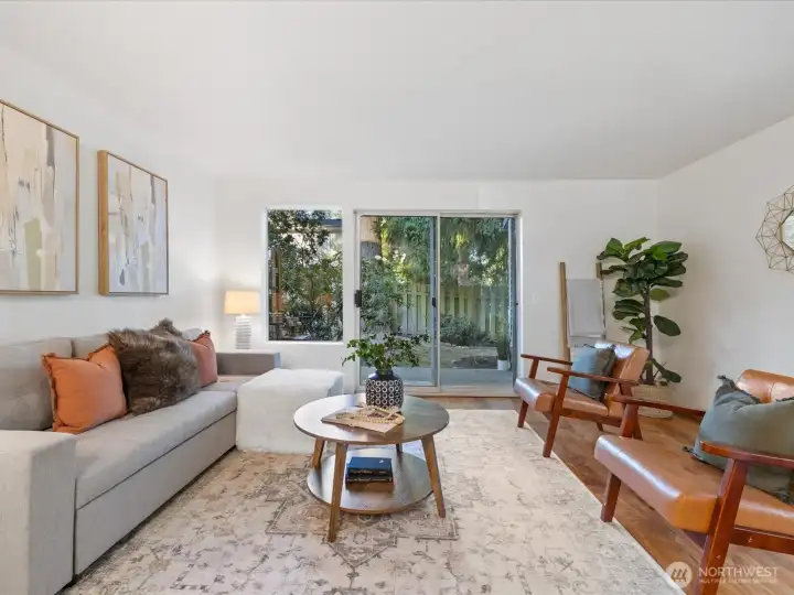 Spacious great room / living room opens to private patio