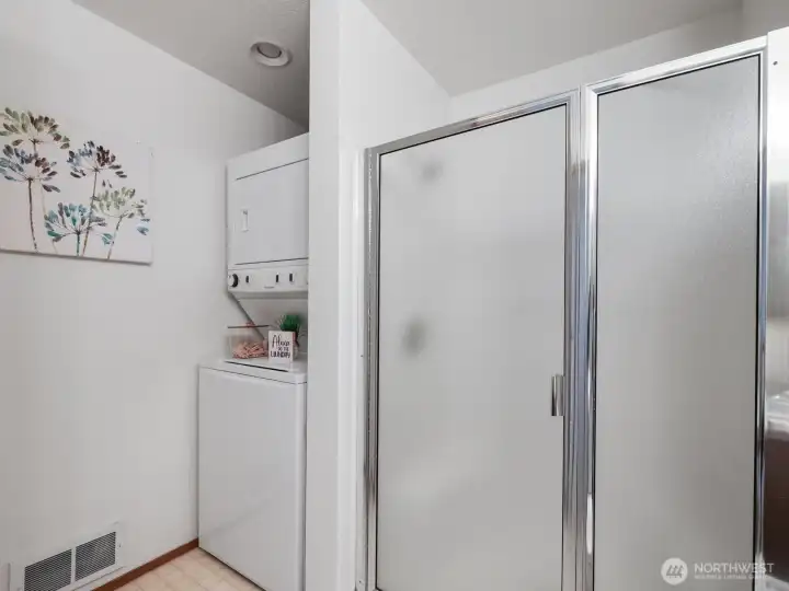 Upstairs 3/4 bathroom shower with stacked washer/dryer