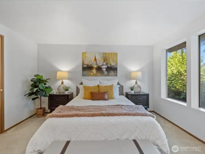Primary bedroom with ample space and natural light