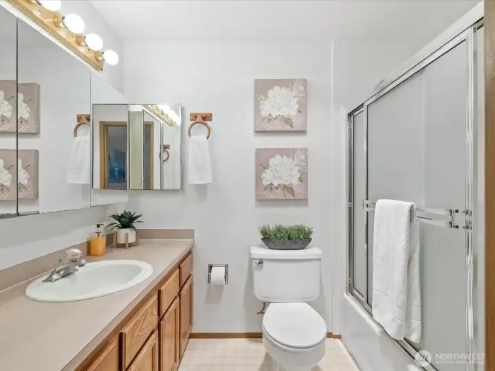 Full primary bathroom with tub and shower combo