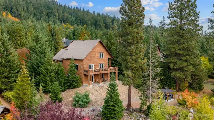 Set on a spacious ½-acre lot, the home maximizes the slope of the land and its stunning views.”