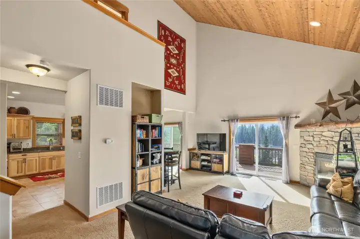 Step inside to soaring ceilings with rich wood accents.