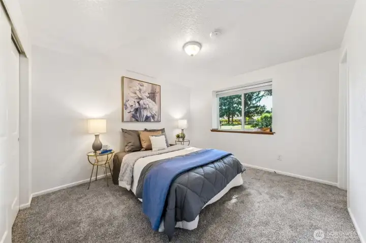 The backyard/course views and filtered light from the back yard envelope the primary suite to set the mood for rest and retreat.  Double closets, with custom shelving keep up with wardrobe needs.