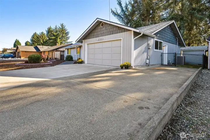 Plenty of off street parking is available on the extra long driveway and side parking that extends from the street to the fence. Room for most RV's. The chain link fence surrounding the back yard includes extra wide gates on both sides of the home,