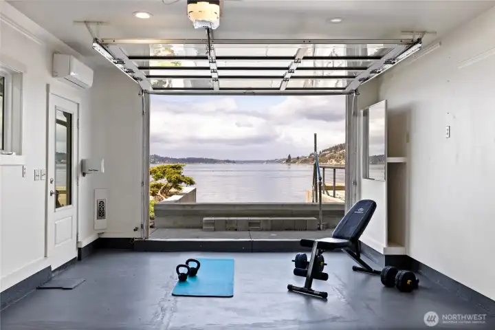Studio with garage door open to the water.