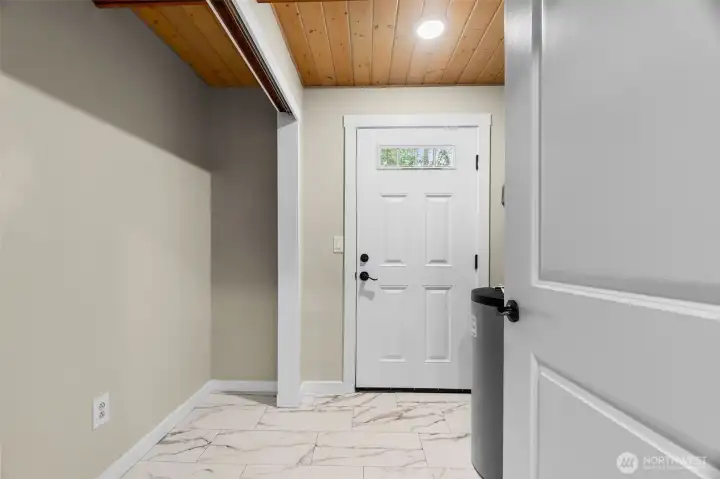utility/mud room leads to backyard