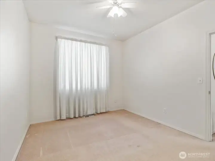 Second bedroom  with a ceiling fan to enhance airflow and comfort.
