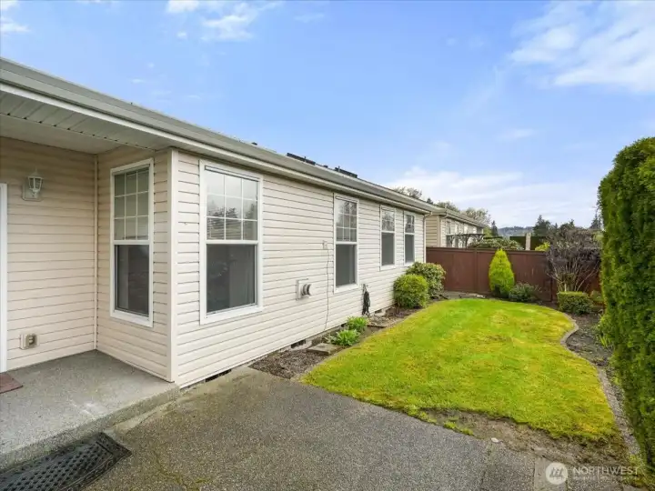 Private fully fenced backyard with a patio and a manageable yard for easy upkeep.