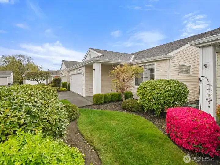 Established landscaping with mature plants and shrubs perfectly maintained so you can relax without the all the yard work.