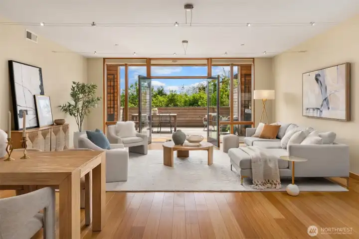 The great room offers flexibility for various furniture arrangements that might suit your needs, with ample space for more than one seating area as well as a large dining set.