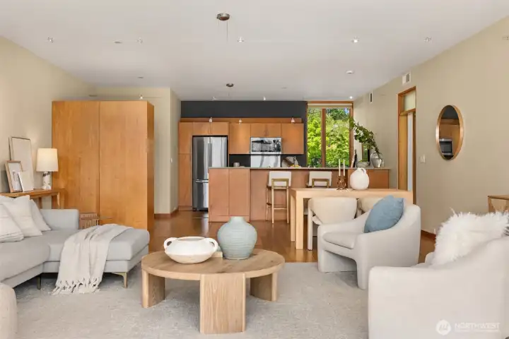 The great room connects nicely with the kitchen, while the front door is cleverly hidden from view thanks to a built-in storage closet that creates an welcoming entry area with a place to stash your coat and shoes.
