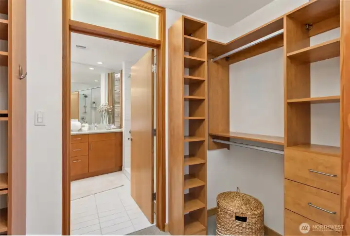 A large 2-sided pass-through closet leads to the primary bedroom’s en suite 3/4 bathroom.