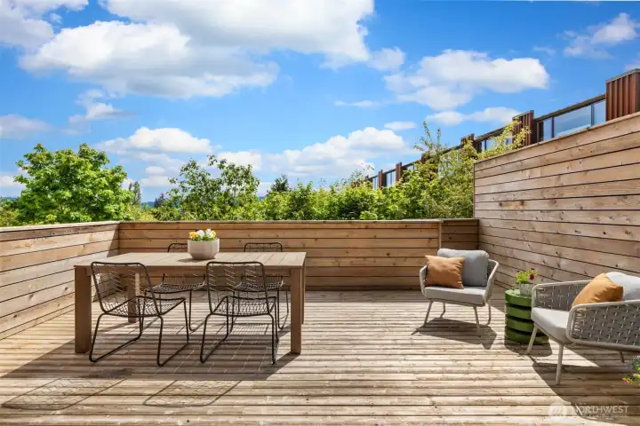 Note the combination of full sun exposure and incredible privacy, thanks to attractive cedar walls and the deck’s position slightly elevated above the gorgeous grounds of The Grove just to the south.