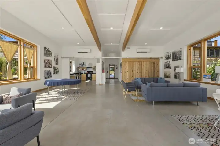 The interior of the community center, which includes lounging spaces and a full kitchen. Reserve it for your next party, and be sure to invite some of your new neighbors!