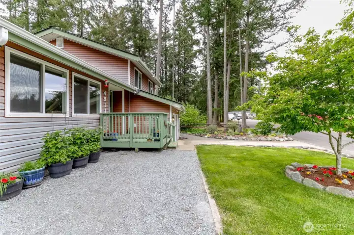 Meticulously maintained landscaping and beautiful trees surrounding the house and property.