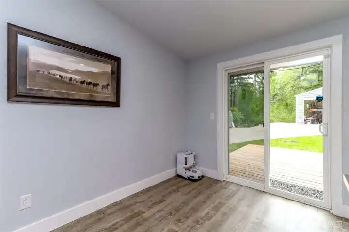Dining room leads through the sliding glass door to the deck.