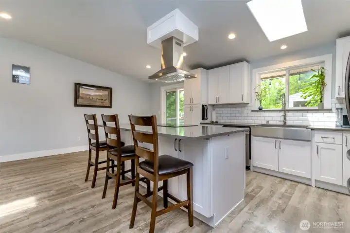 Beautifully updated kitchen with stainless steel appliances and farm sink.