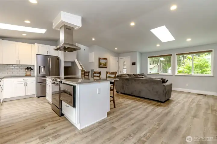 An abundance of light here with lots of canned lights, skylights and natural lights from the large windows.