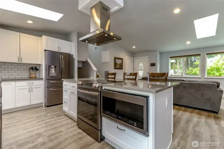 All updated appliances, LVP flooring, subway tile and quartz countertops.