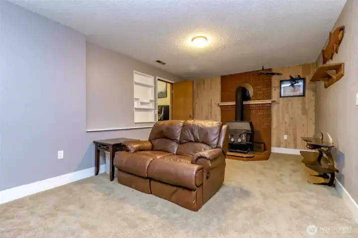 Lower level family room with wood stove.