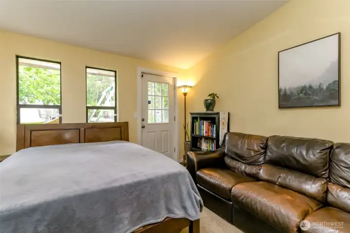 This is another angle of the flex room and shows the access to the backyard. Vaulted ceiling and windows offering lots of natural light.