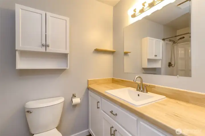 3/4 bath with updates. Shower pictured in mirror.