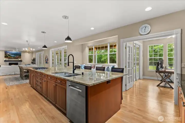 Rich hardwood flooring and refreshed solid wood cabinetry add timeless style
