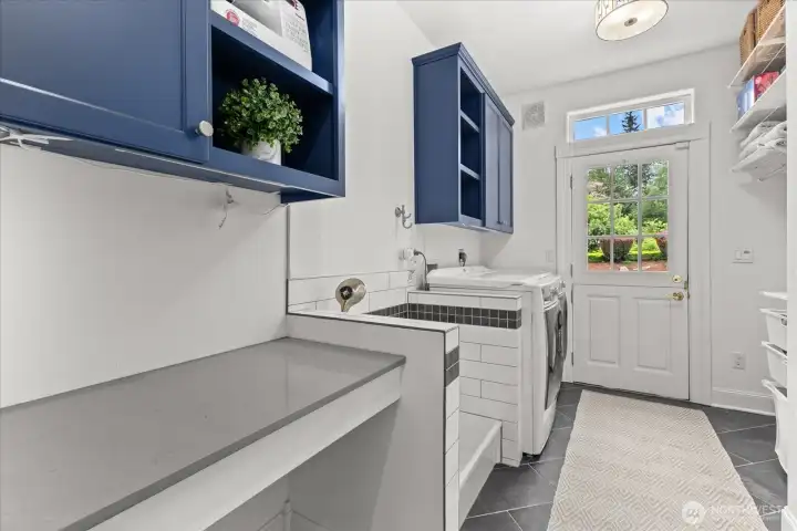 Functional utility room featuring a built-in pet washing station