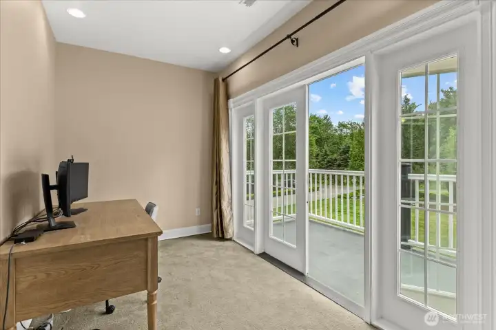 View of the private sitting room and deck off the primary suite
