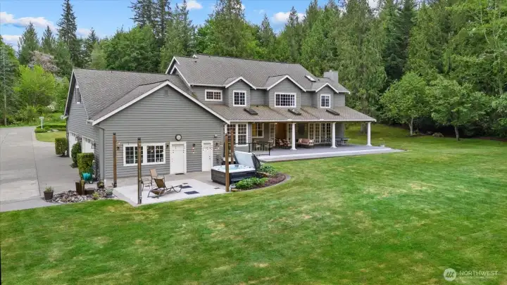 Separate patio space off the garage ideal for entertaining or soaking in the hot tub