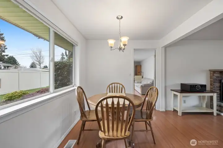 View of the entertainment room from the kitchen.  The large window definitely brightens up the whole room.