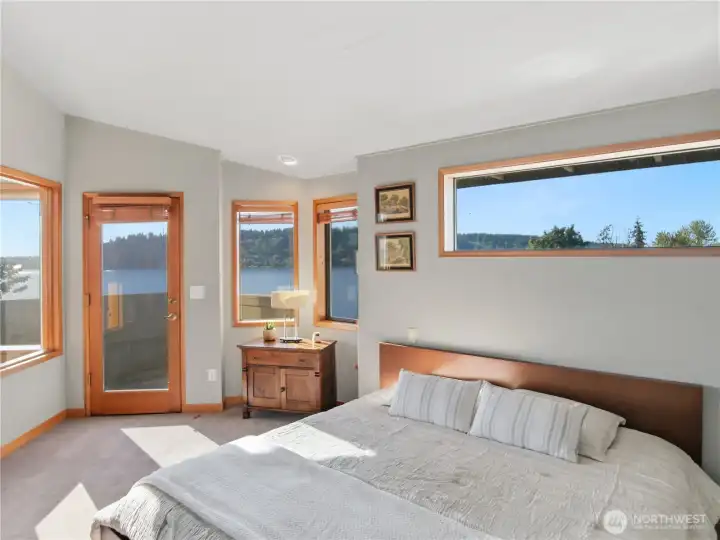 Spacious primary bedroom retreat with vaulted ceiling detail and tranquil natural light