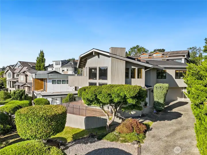 Plenty of parking options including a 2-car garage, 2 bonus spots, and additional driveway space