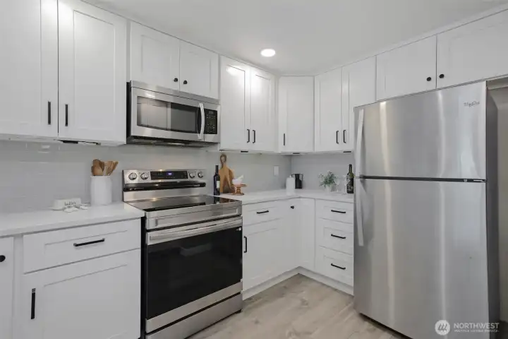 Modern cabinetry and newer stainless steel appliances make for an easy cooking experience