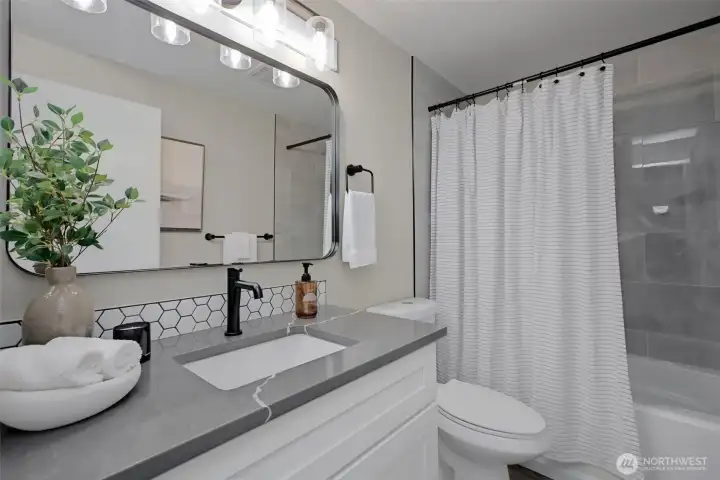 Hallway bathroom has a tub for ultimate convenience