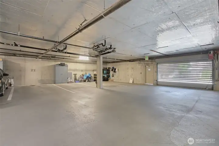Enter the secured parking garage from SW Alaska St