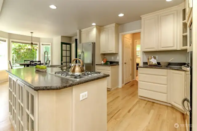 The hallway in kitchen leads to a large walk in food pantry (door on the left) then on through to the 3/4 bathroom and utility room.