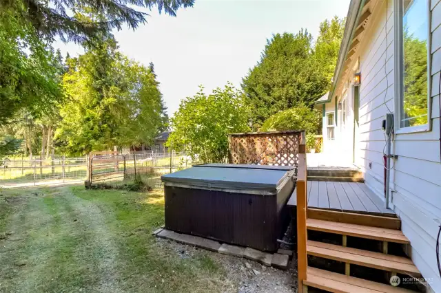 Primary bedroom door leads to the hot tub behind the house.