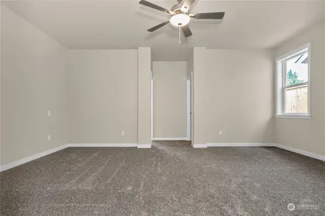 Primary bedroom includes ceiling fan with light fixture.  Photo for illustration only, not actual