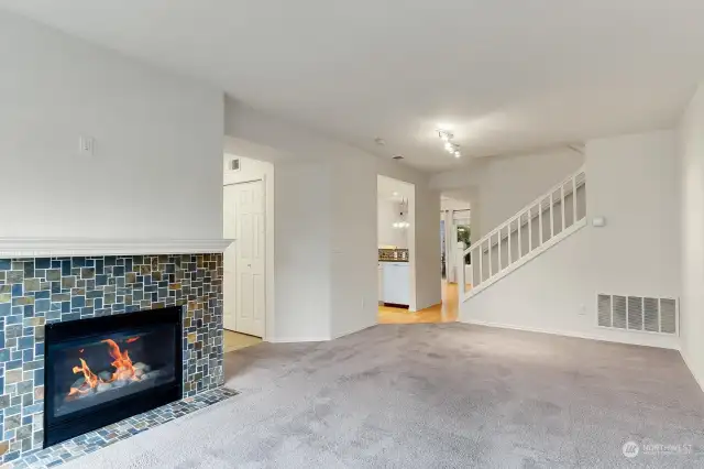 Spacious entry with cozy living room, gas fireplace.