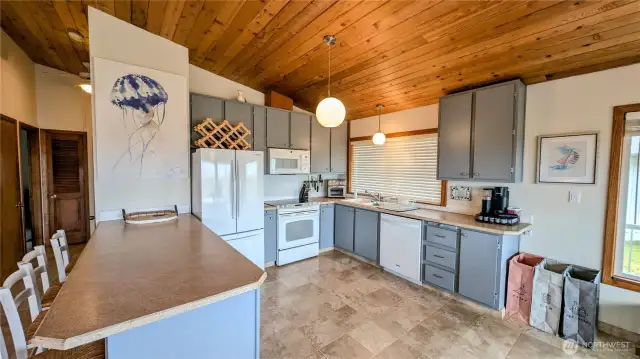 Large kitchen with eat-in bar.