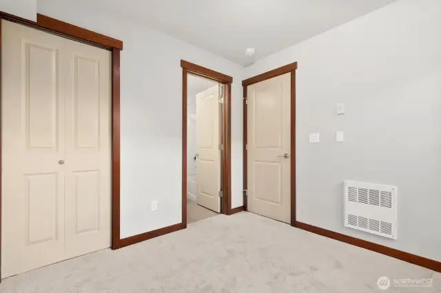 lower level bedroom with it's own full bathroom. Great as an office and/or guest room