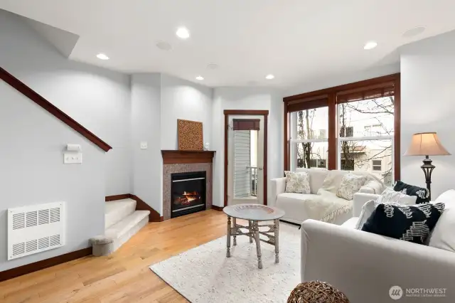 Livingroom with gas fireplace and access to small deck