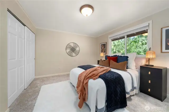 Good sized primary bedroom upstairs also has a view overlooking the greenbelt.